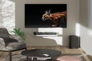 AMBEO Soundbar Min unter TV in einem Wohnzimmer